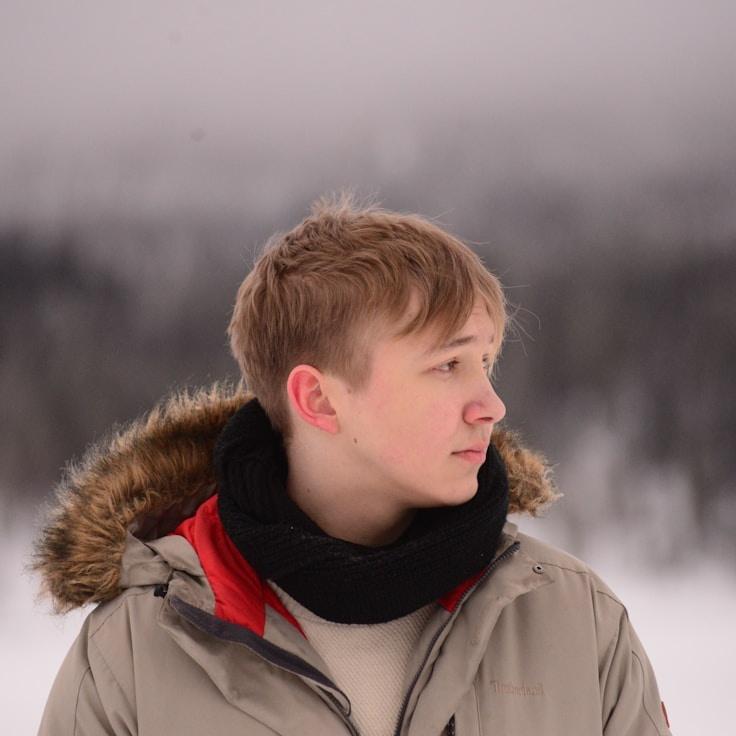 Kaveri Mehta, Lead Design Curator at RidgeFoldHaven, reviewing corporate floral arrangements